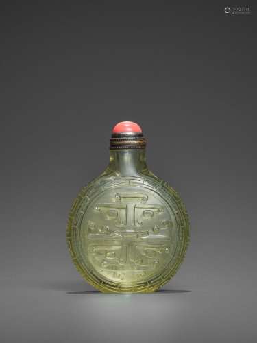 A TRANSPARENT OLIVE-GREEN GLASS ‘TAOTIE’ SNUFF BOTTLE, QING DYNASTY
