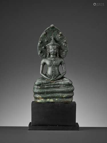 A KHMER BRONZE FIGURE OF BUDDHA MUCHALINDA, LATE ANGKOR PERIOD