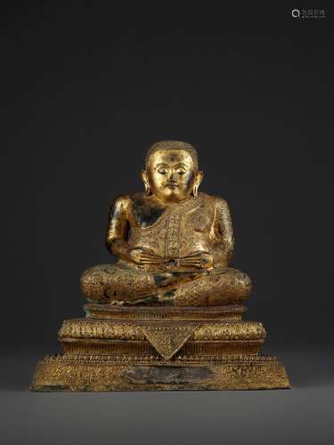 A LARGE GILT BRONZE STATUE OF MAHAKATYAYANA, RATTANAKOSIN KINGDOM