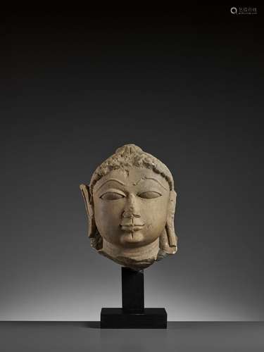 A JAIN SANDSTONE HEAD OF A JINA