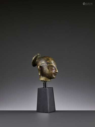 AN INDIAN GILT BRONZE HEAD OF DURGA