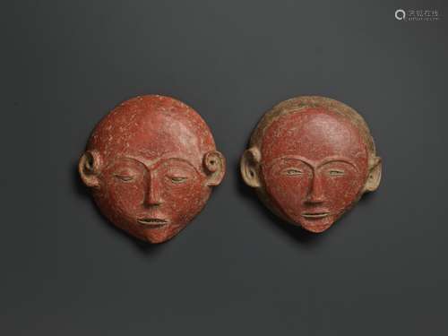 A PAIR OF CERAMIC ANCESTRAL MASKS