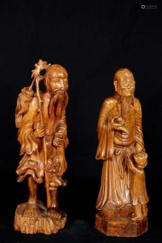 中国，19世纪。木雕的寿老等两尊神像。高度：46厘米和49厘米。罕见的裂痕。