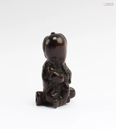 A Carved Wooden Figurine