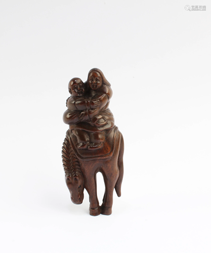 A Carved Wooden Figurine