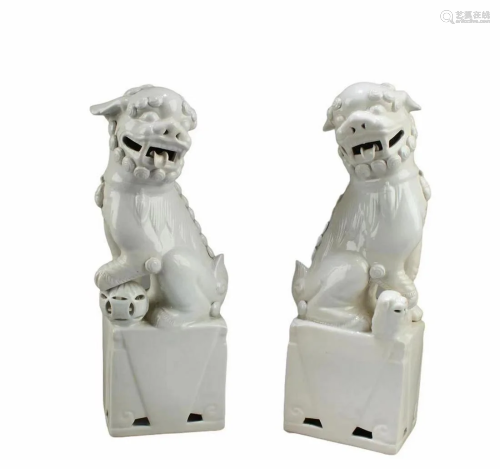 A Pair of Blanc De Chine Foo Lion Statues