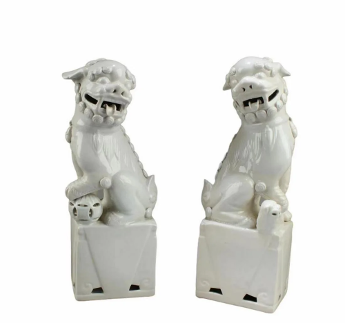 A Pair of Blanc De Chine Foo Lion Statues