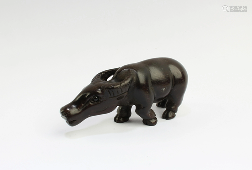 A Carved Wooden Buffalo Figurine