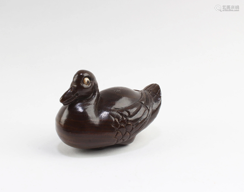 A Carved Wooden Duck Figurine