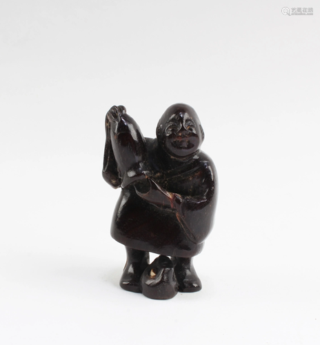 A Carved Wooden Figurine