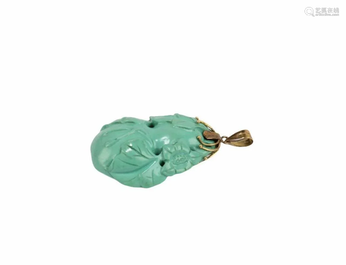 A Carved Turquoise Pendant