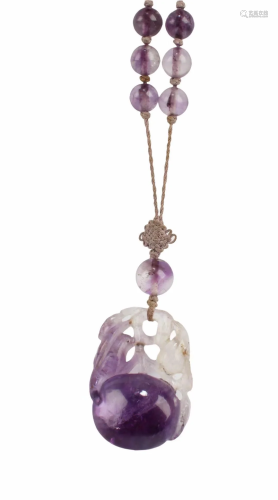 A Carved Lavender Crystal Pendant with Necklace