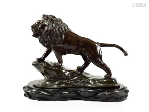 A Japanese Bronze Figure of a Lion, Meiji period, standing on a rocky promontory with waves below,
