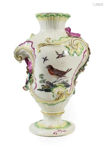 A Derby Porcelain Rococo Scroll Vase, circa 1765, of asymmetric baluster form, painted with exotic