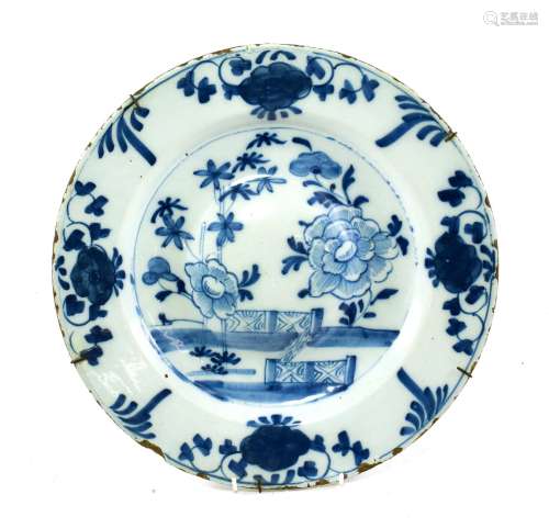 An English Delft Stand, circa 1760, of circular form, the convex centre painted in blue with peony