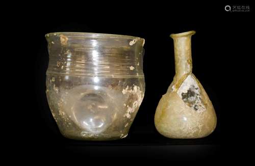 A Roman Glass Beaker, probably 4th century AD, with slightly everted rim and band of three lines and