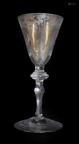 A Light Baluster Wine Glass, circa 1740, the rounded funnel bowl engraved with a border of birds,