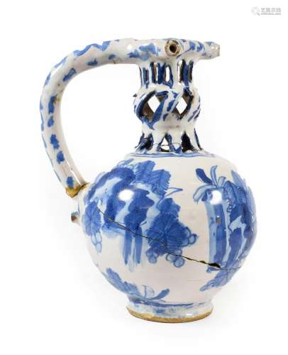 A Dated English Delft Puzzle Jug, London or Brislington, 1670, of ovoid form, the knopped pierced