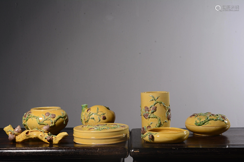 A SET OF SEVEN YELLOW-GLAZED BRSHOPOT,WASHER AND