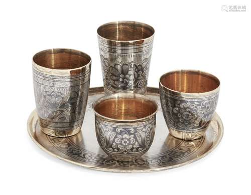 A Russian silver niello coaster with four various Russian silver niello beakers, all post 1958