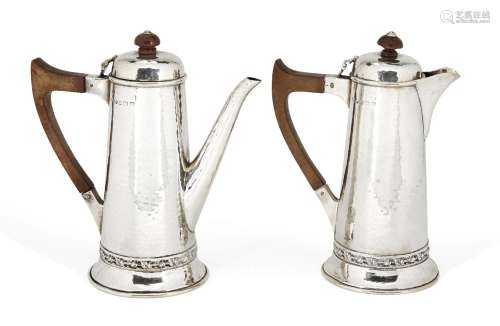 A pair of hammered silver café-au-lait pots, Birmingham, c.1945, G. Payne & Son, the tapering