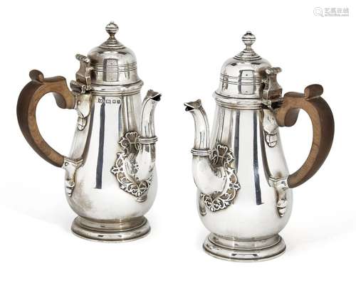 A pair of Victorian silver café-au-lait pots, London, c.1887, Mappin & Webb, designed as