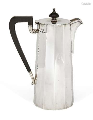 A panelled silver hot water pot, Birmingham. c.1934, Daniel & Arter, of faceted cylindrical form