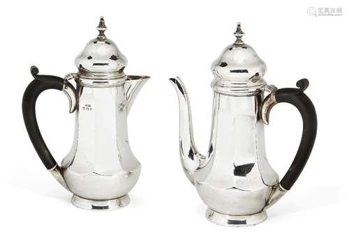 A pair of George V silver café-au lait pots, Birmingham, c.1928 and 1929, Joseph Gloster Ltd, of