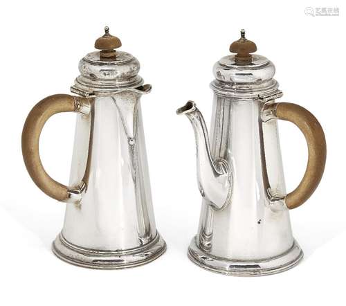 A bachelor's pair of silver café-au-lait pots, London, c.1928, Wakely & Wheeler, of tapering