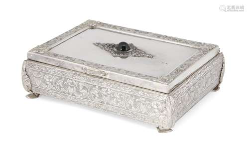 A decorative silver trinket box, stamped 800, the lid designed with central green cabochon stone