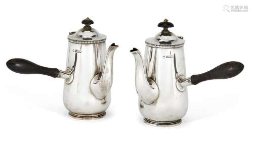 A pair of Edwardian silver café-au-lait pots, Sheffield, c.1908, Martin, Hall & Co, comprising two