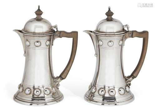 An Edwardian silver bachelor's café-au-lait pair, London, c.1907, Wakely & Wheeler, each pot of