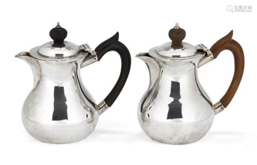 Two Scottish silver café-au-lait pots, Edinburgh, c.1911 and 1912, Brook & Son, of rounded