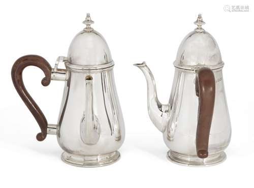 A pair of silver café-au-lait pots, London, c.1924, Reid & Sons Ltd, of baluster form with wooden