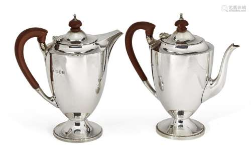 A pair of silver café-au-lait pots, London, c.1938, Edward Barnard & Sons, each pot with curved