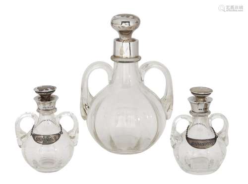 A bulbous silver mounted decanter and pair of whisky tots, the decanter Birmingham, c.1920, John