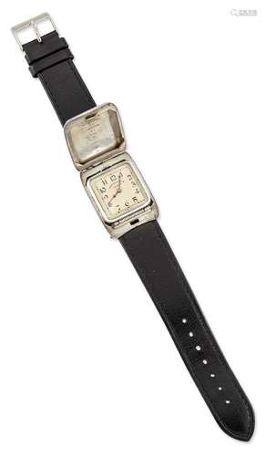 An early 20th century silver wristwatch by Kendal & Dent, c.1930, the square pop up dial with Arabic