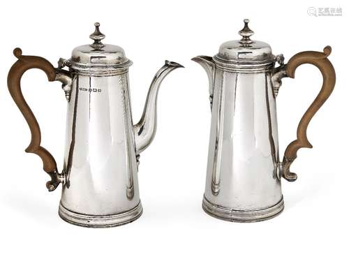 A pair of silver café-au-lait pots, Birmingham, c.1944, Thomas Ducrow & Sons, of tapering