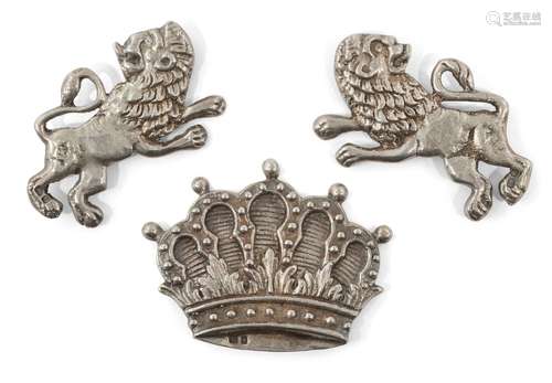 A pair of silver mounts designed as lions, together with a further mount designed as a crown, all