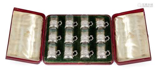 A cased set of twelve Hanau silver and glass liqueur glasses, the silver holders with London