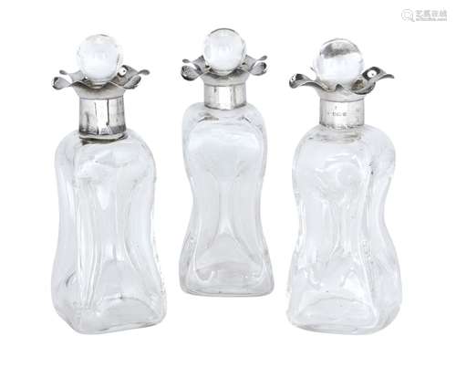 Three silver mounted whisky tot decanters, Birmingham, c.1928, William Devenport, each of squared