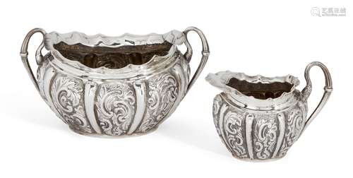 A matched repousse silver cream jug and sugar, Birmingham, c.1911 and c.1891, makers HIM and LS,