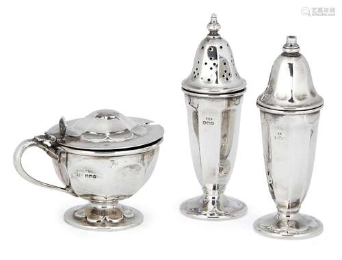 A three-piece silver cruet set, Sheffield, c.1964 and 1966, Viner's Ltd., of panelled design, the