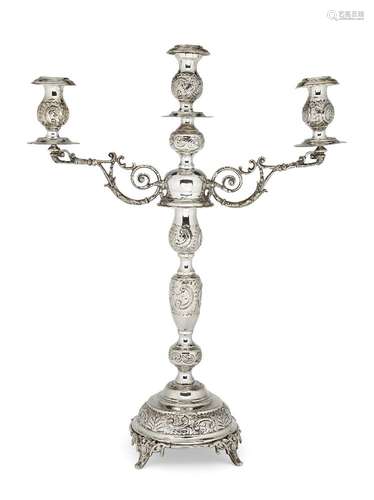 A silver three-branch candelabra, London, c.1919, Rosenzweig, Taitelbaum & Co., the central