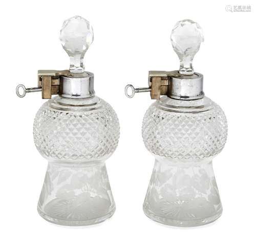 A pair of silver mounted lockable glass decanters, London, c.1927, George Betjemann & Sons, the