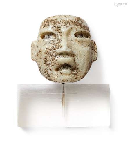 A carved stone Olmec-type mask, 4.5cm high, on perspex standPlease refer to department for condition