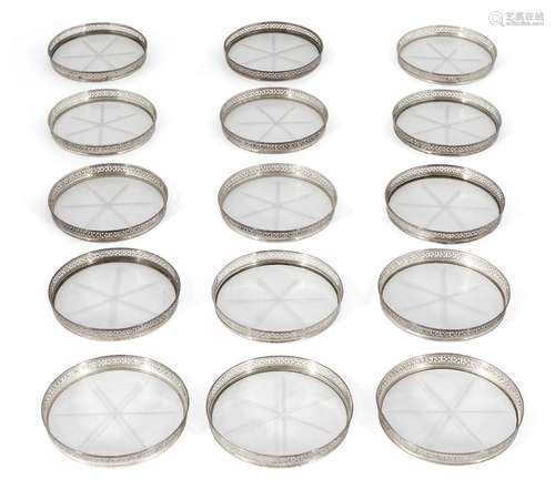 A set of fifteen cut glass and white metal coasters, star motif to each glass base, the sides