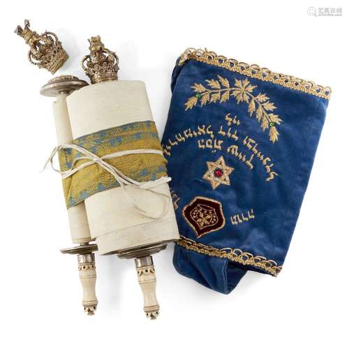 A miniature Sefer Torah mounted on ivory tipped rollers with gilt crown finials (one detached),