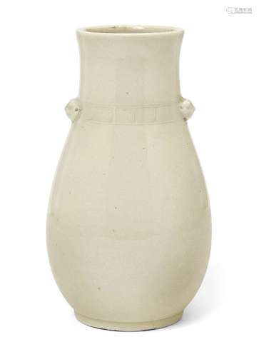 A Chinese Dehua porcelain vase, late Qing dynasty, of ovoid form, the neck incised with Greek key