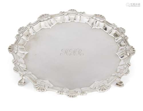 A small George III silver salver, London, c.1763, Elizabeth Cooke, raised on three hoof feet, the